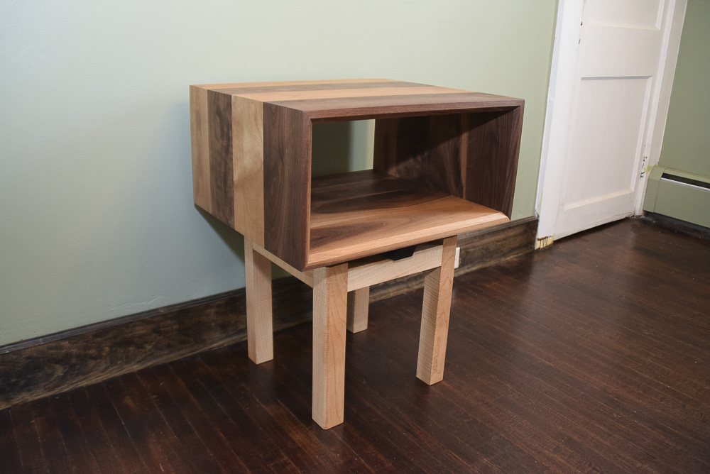 angle view of the walnut and maple open end table