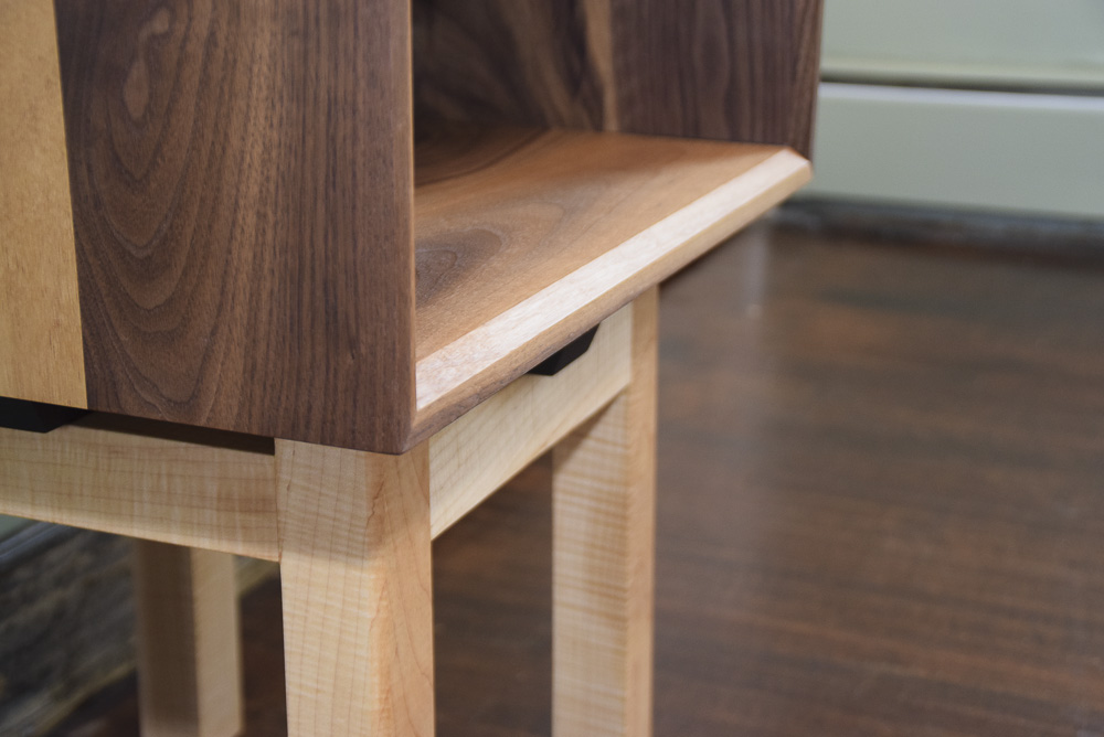 chamfer detail of the walnut and maple open end table