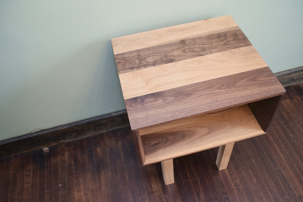 top view of the walnut and maple open end table