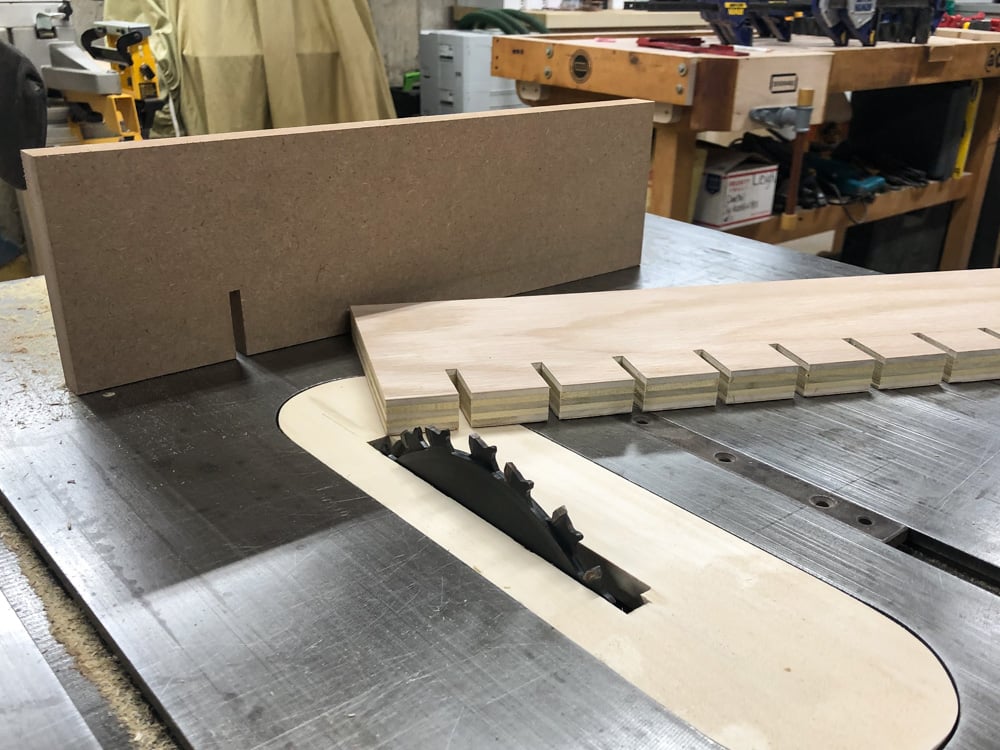 cutting the plywood for the quick clamp rack on the tablesaw