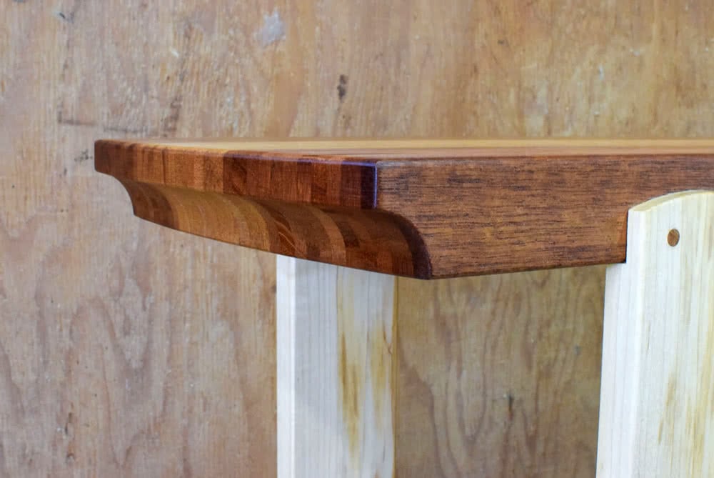 Mahogany and Maple Console Table top cove and individual strips detail