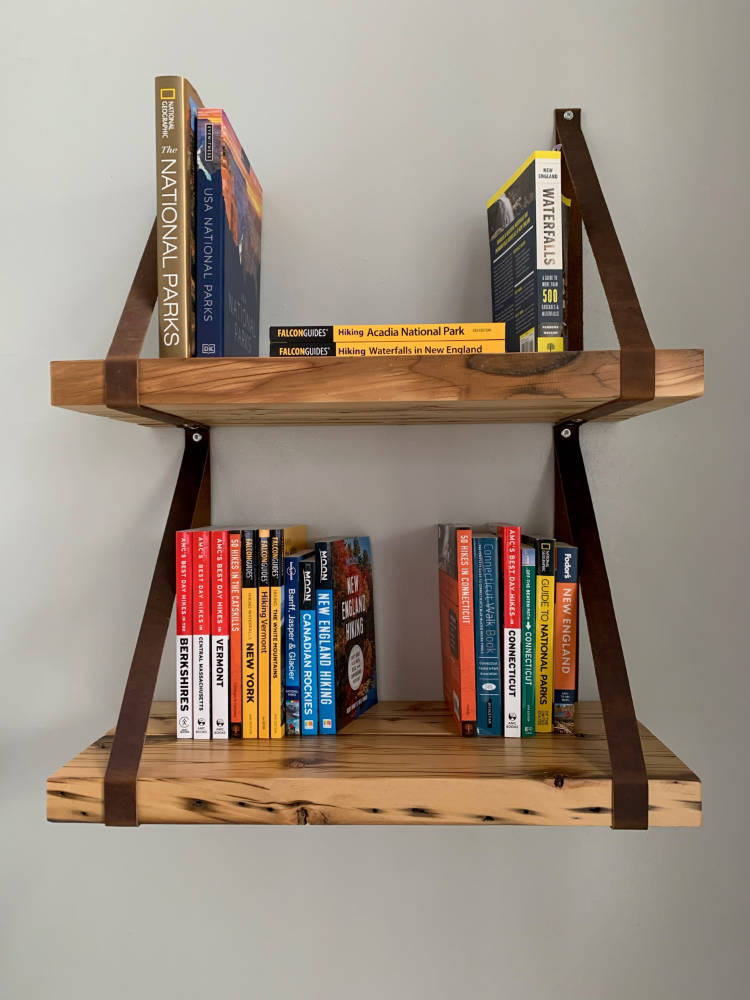 custom home decor. rustic hemlock shelves hanging by brown leather straps