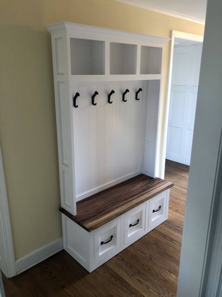 custom furniture. white hallway cubby with exotic wood seat and drawers