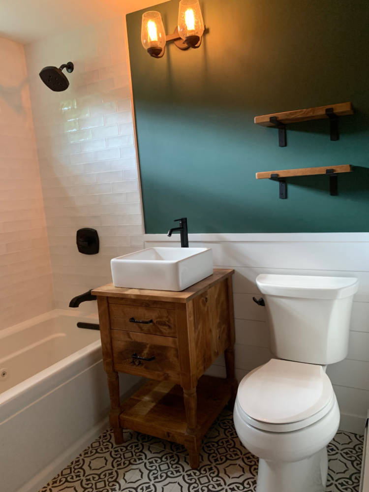 custom furniture. knotty alder turned-leg bathroom vanity with farmhouse vessel sink